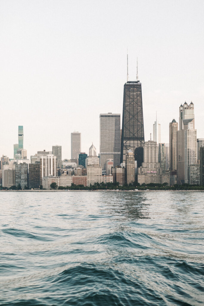 view of the Chicago skyline from Oak Street Beach during a summer engagement session