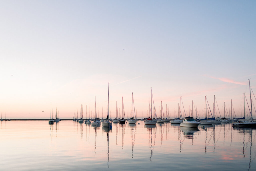 A view of sailboats in Chicago's Lake Michigan Harbor during the summer right before the sunrises